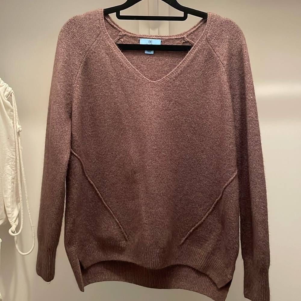 Purple Cece sweater, has a wool appearance